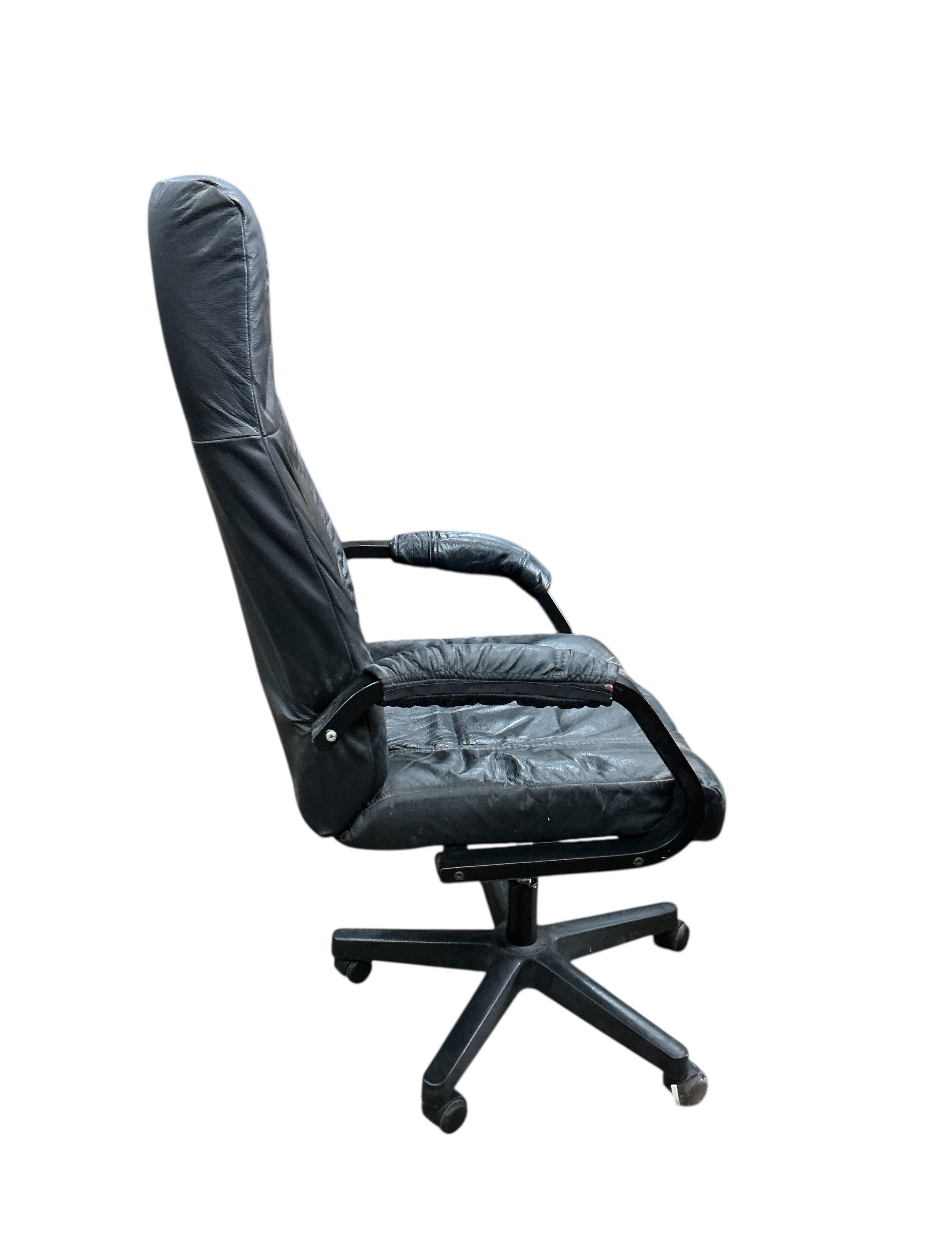 A Danish leather swivel desk chair, width 64cm, depth 58cm, height 122cm
